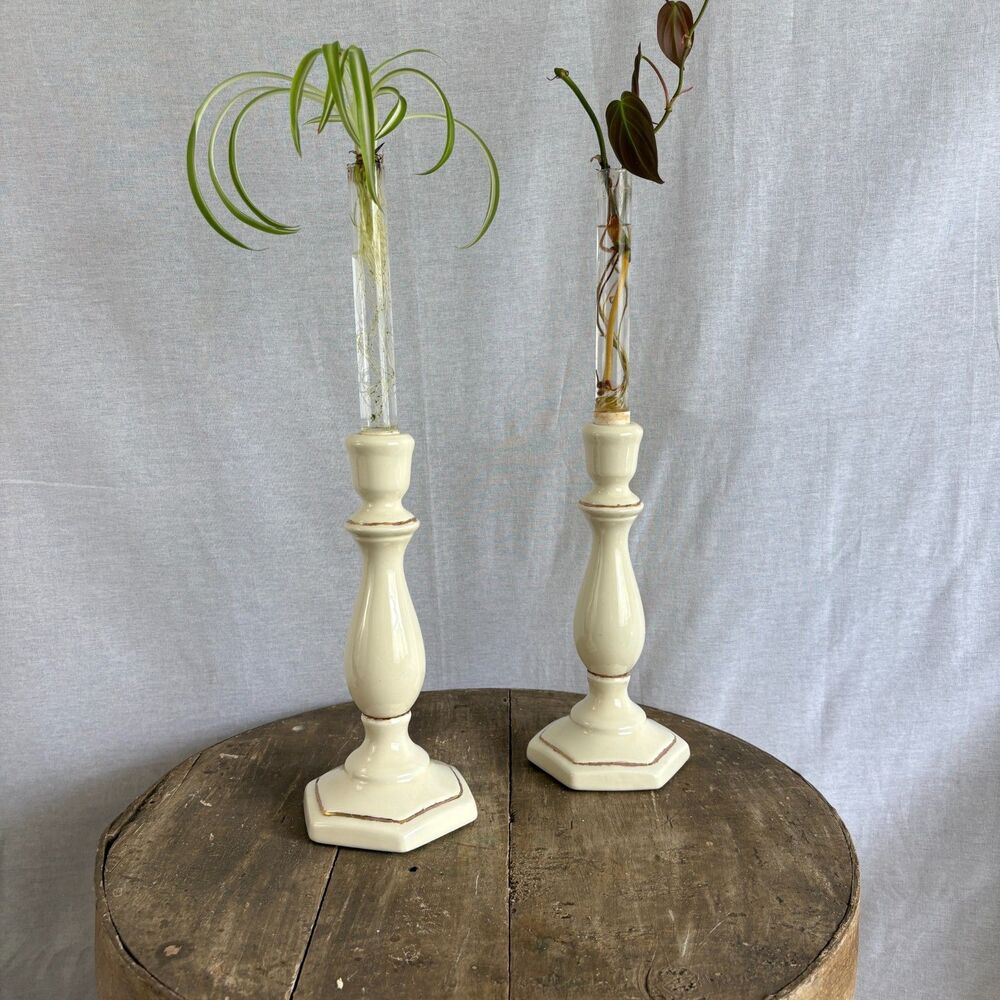 Vintage molded ceramic candlesticks with hand-applied gold gilt detailing.